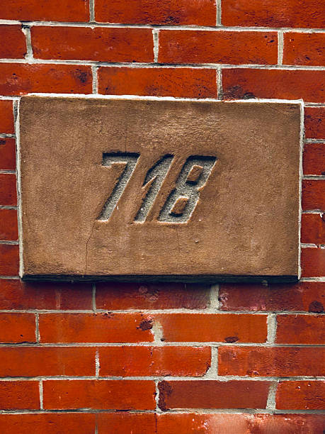 Brick Wall With Address Number 718