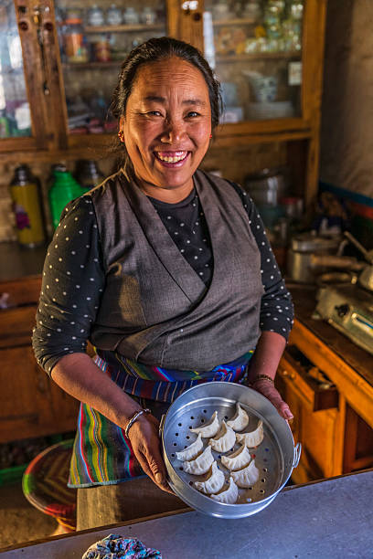 istock Tibetan woman preparing momos, Upper Mustang, Nepal 2206762255