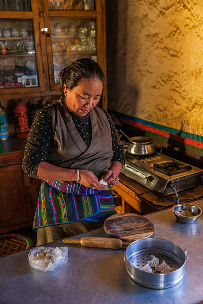istock Tibetan woman preparing momos, Upper Mustang, Nepal 2206762305