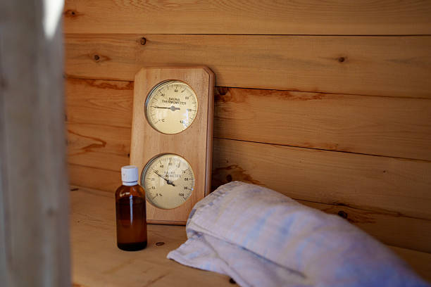 Alcohol thermometer with natural wooden base and double scale of Celsius and Fahrenheit units, top view on a white background