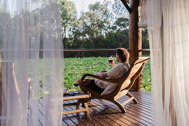 istock Man Relaxing in lake house villa 2206770787