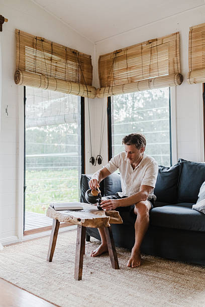 istock Man Relaxing in lake house villa 2206770825