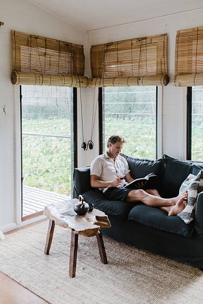 istock Man Relaxing in lake house villa 2206770870