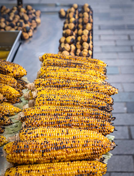 Fried corn and chestnuts. Street vendor.