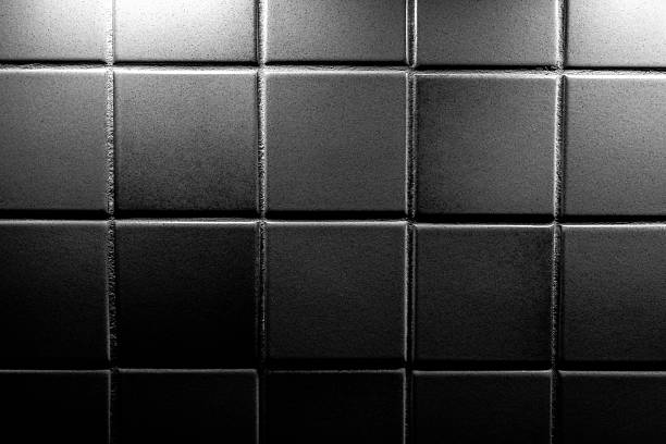 Background with small retro tiles wall in black and white