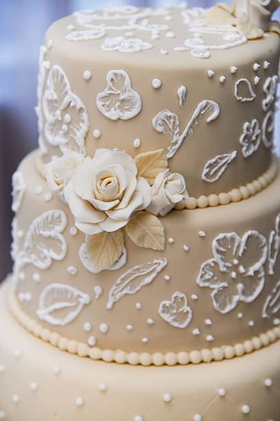 istock Beige wedding cake with floral decorations, close-up 2206781321