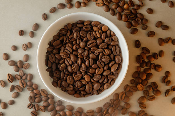istock Freshly roasted coffee beans arranged beautifully in a white bowl 2206787073
