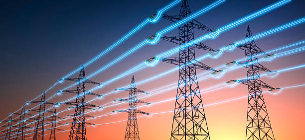 istock Electricity transmission towers with glowing wires 2206787568