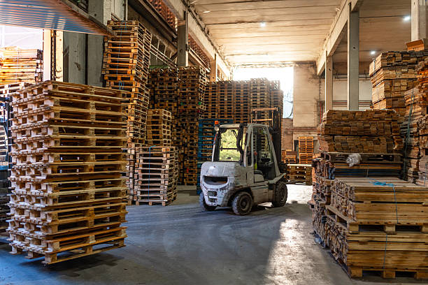 istock Forklift in a pallet storage room in a recycling plant 2206787919