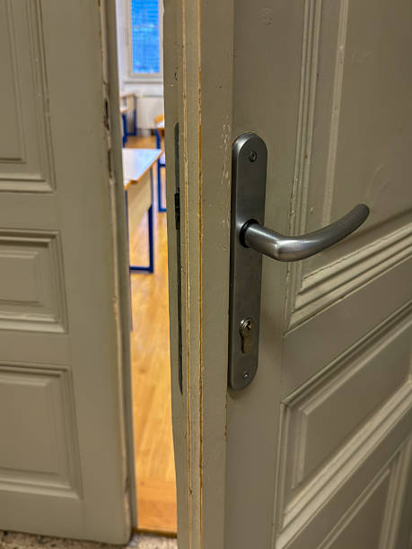 istock Open Classroom Door with View Into Empty Schoolroom 2206787993