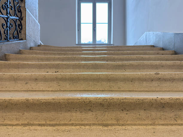 istock Stone Staircase Leading to Bright Window Symbolizing Education and Success 2206788071