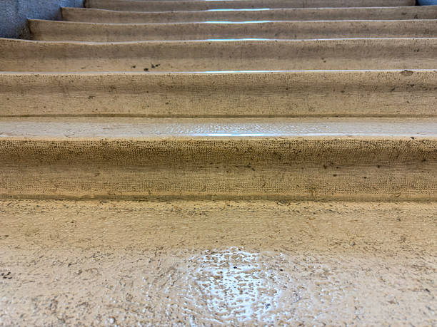 Low Angle View of Worn Concrete Steps Leading Upward Toward Success Concept