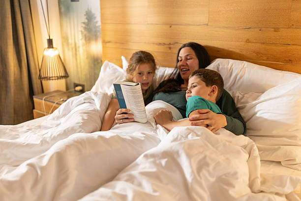 Mother reading stories to her kids