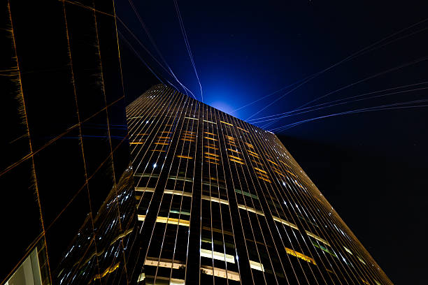 A colorful low angle perspective night photo of Riyadh's Kingdom Tower during Ramadan. It is one of the most iconic architectural landmarks in Saudi Arabia.