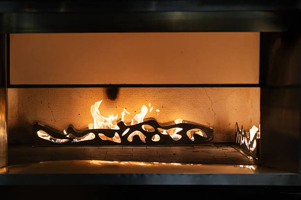 istock Fire flames burning in a modern indoor fireplace. 2206791658