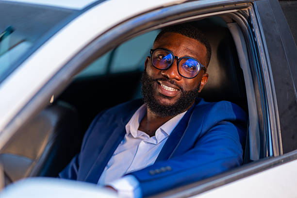 istock Successful African businessman sitting in his car. 2206794208
