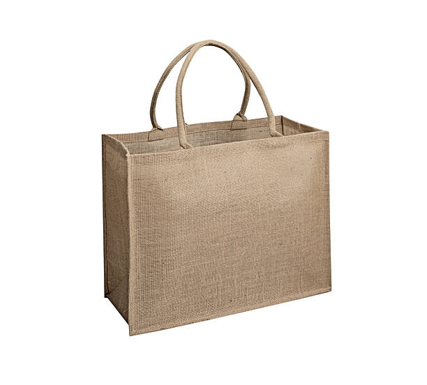 Organic textile bag isolated on white, hessian tote, nobody single object. Recycled textile, product package.