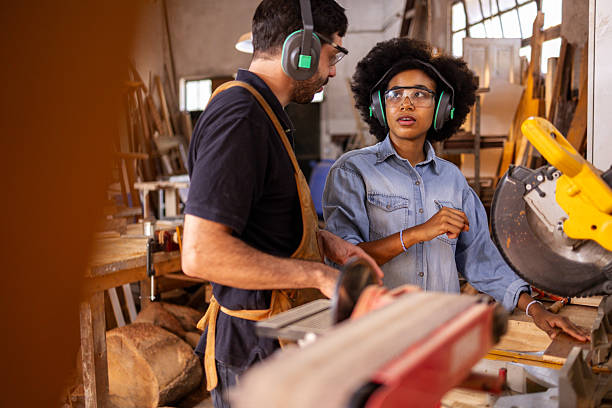istock Collaboration in a sustainable woodworking workshop with diverse artisans at work 2206795698