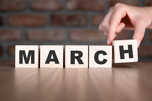 istock March word with wooden blocks on table 2206798910