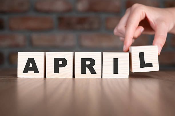 istock April word with wooden blocks on table 2206799018