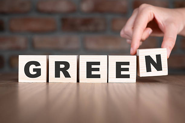 istock Green word with wooden blocks on table 2206799088