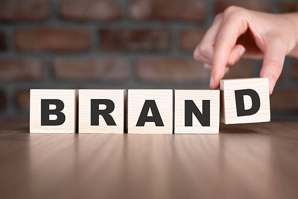 istock Brand word with wooden blocks on table 2206799325