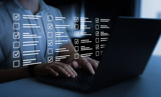 istock Businessman work at laptop doing online data checklist survey. Productivity checklist and filling survey form online. Fast checklist,clipboard task business management. 2206800744