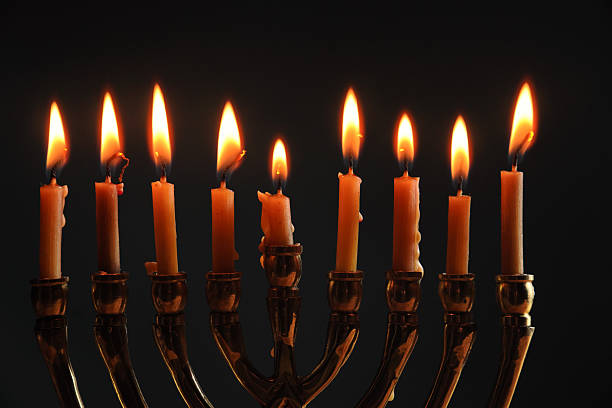 istock Traditional Menorah with Nine Candles Lit for Hanukkah Celebration 2206803129