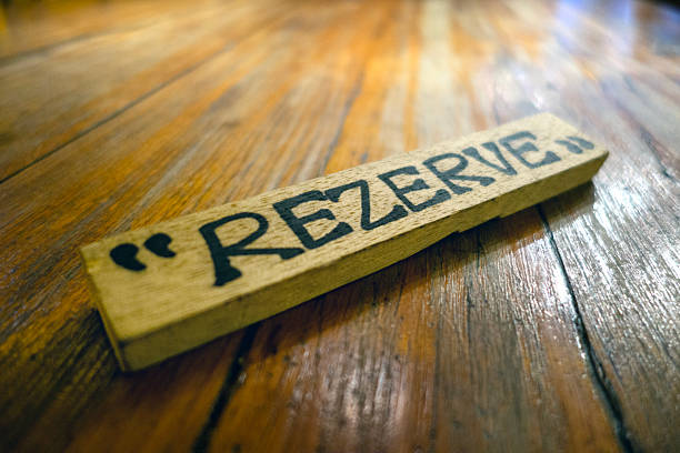 Close-up on a reserved sign on a table at a restaurant.