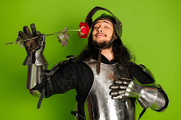 Medieval knight wearing armor holding a red rose against a bright green background