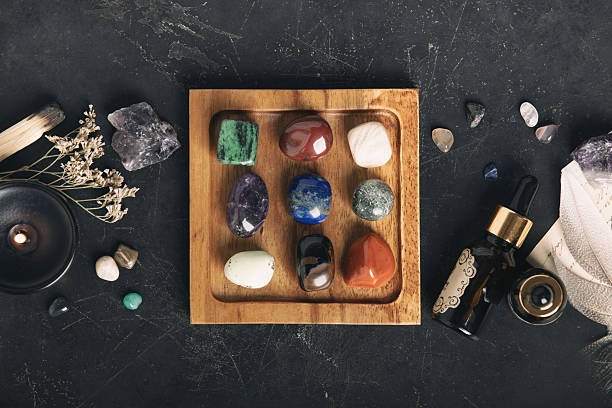 istock Healing Crystals and Aromatherapy Display on Wooden Tray 2206805760