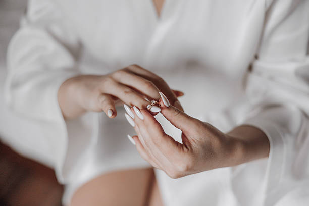 istock A woman is holding a ring in her hand 2206813813