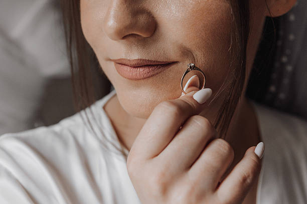istock A woman is holding a ring in her hand 2206813842
