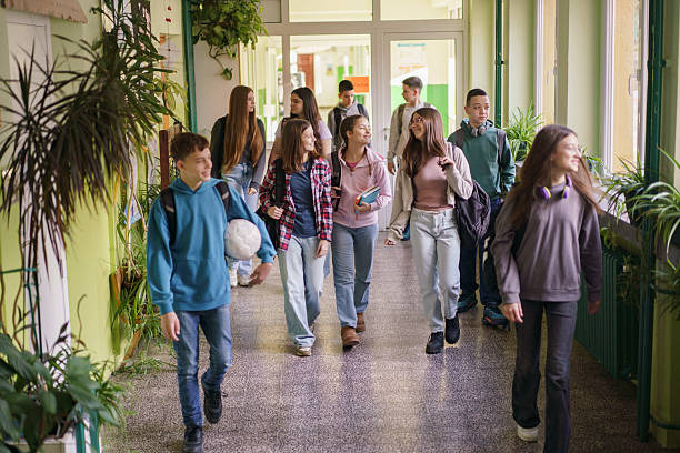 istock Children with backpacks are walking in the school corridor 2206814879