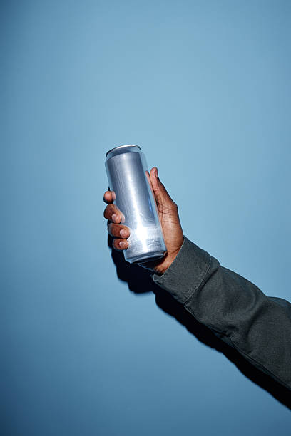 istock Holding Aluminum Can in Hand Under Dramatic Lighting 2206816469