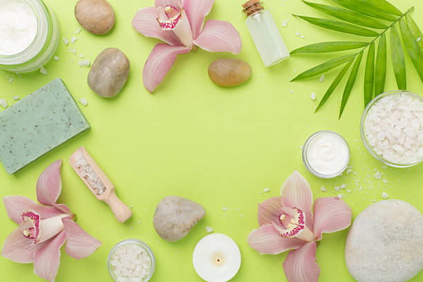 istock Composition with orchids and massage stones on color background, top view 2206816584