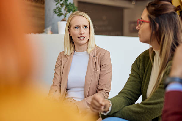 istock Young Professional Women Discussing Ideas in a Collaborative Office Environment 2206817572