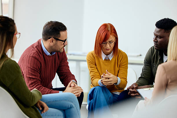 istock Group Therapy Session with Individuals Sharing and Supporting Each Other 2206817589