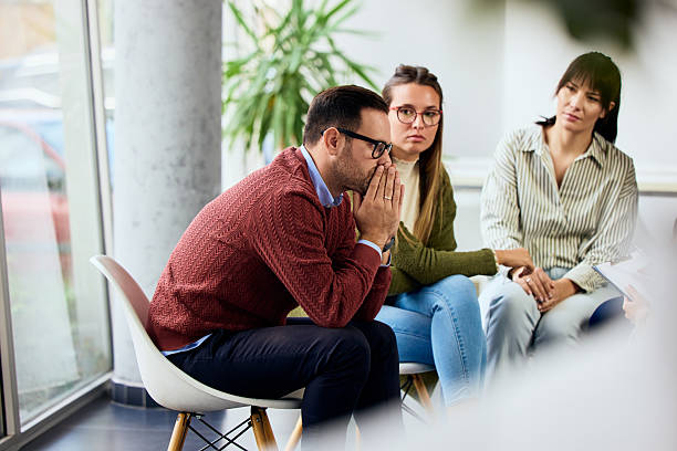 Support Group Session With Attentive Participants Sharing Emotions and Experiences