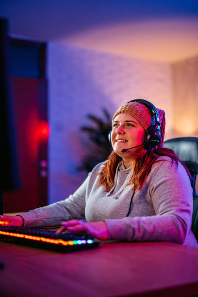 istock Young Woman Playing A Video Game On Her Desktop PC 2206818694