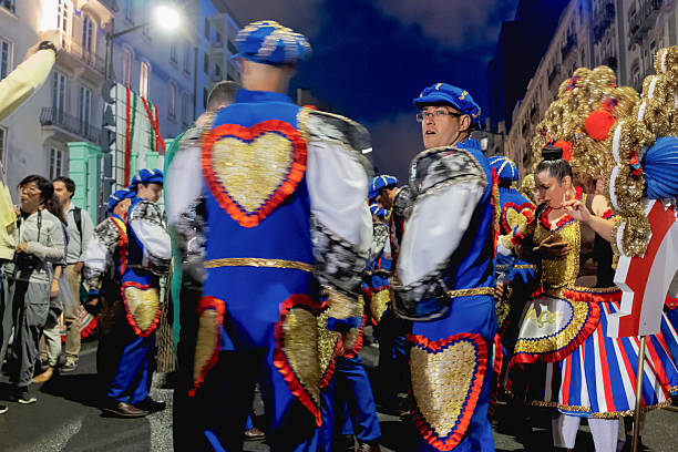 Lisbon, Portugal - June 12, 2023: Men and women dressed in traditional folklore costumes, prepare to parade in Lisbon downtown during this city celebrations of the Popular Saints.