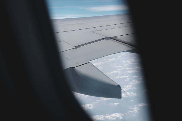 istock A breathtaking airplane wing view high above the beautiful clouds in the endless sky 2206819967