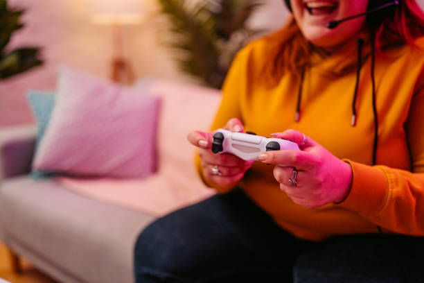istock Young Woman Playing A Video Game On A Joystick At Home 2206821439