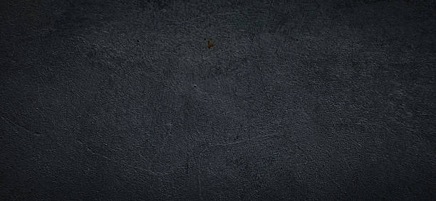 istock Close-up of a dark gray wall with a rough and textured surface. Textured background with sharp photo details. Premium for background. 2206822437
