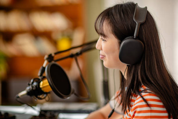 istock Engaged podcast host enjoys a lively discussion during a recording session in a studio environment 2206822717