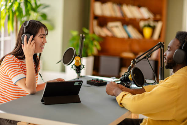 istock Engaging Conversation During a Podcast Session with Young Adults in a Studio Setting 2206823409