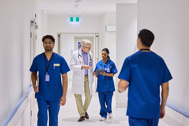 istock Mature doctor discussing medical reports with nurse 2206823697