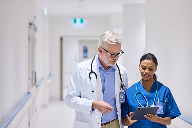 istock Mature medical discussing medical reports 2206823702