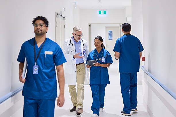 istock Doctor explaining medical reports to nurse on tablet PC 2206823704