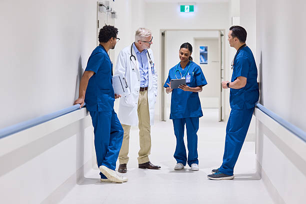 istock Female nurse using digital tablet to show medical records 2206823713
